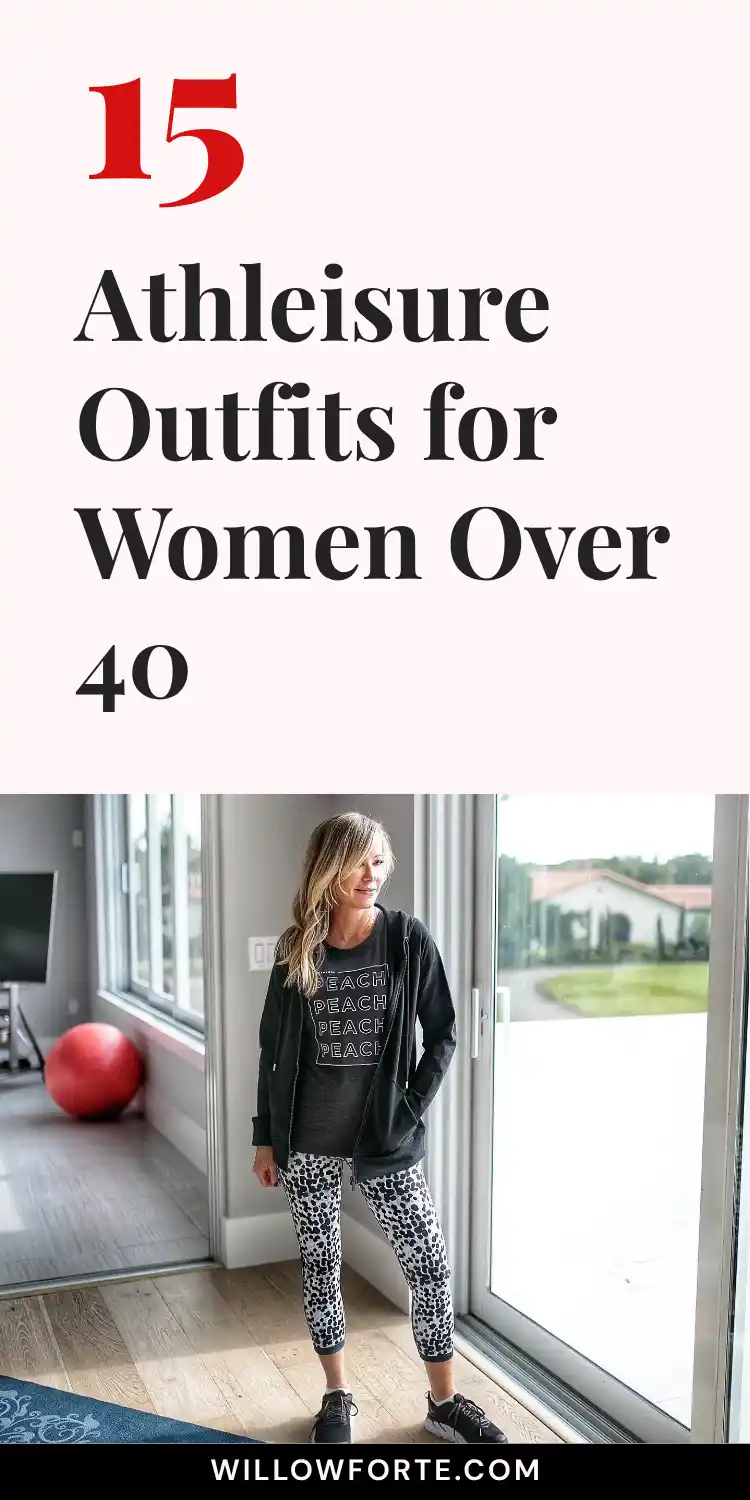 15 Athleisure Outfits for Women Over 40 17 A woman with wavy blonde hair stands by floor to ceiling glass doors in a home gym, wearing a cropped zip hoodie over a dark graphic tee reading "peach," speckled print leggings, and black sneakers, with a red exercise ball and blue yoga mat nearby. Bold red and black text above reads 15 Athleisure Outfits for Women Over 40, highlighting this women's activewear and home gym outfit combination.