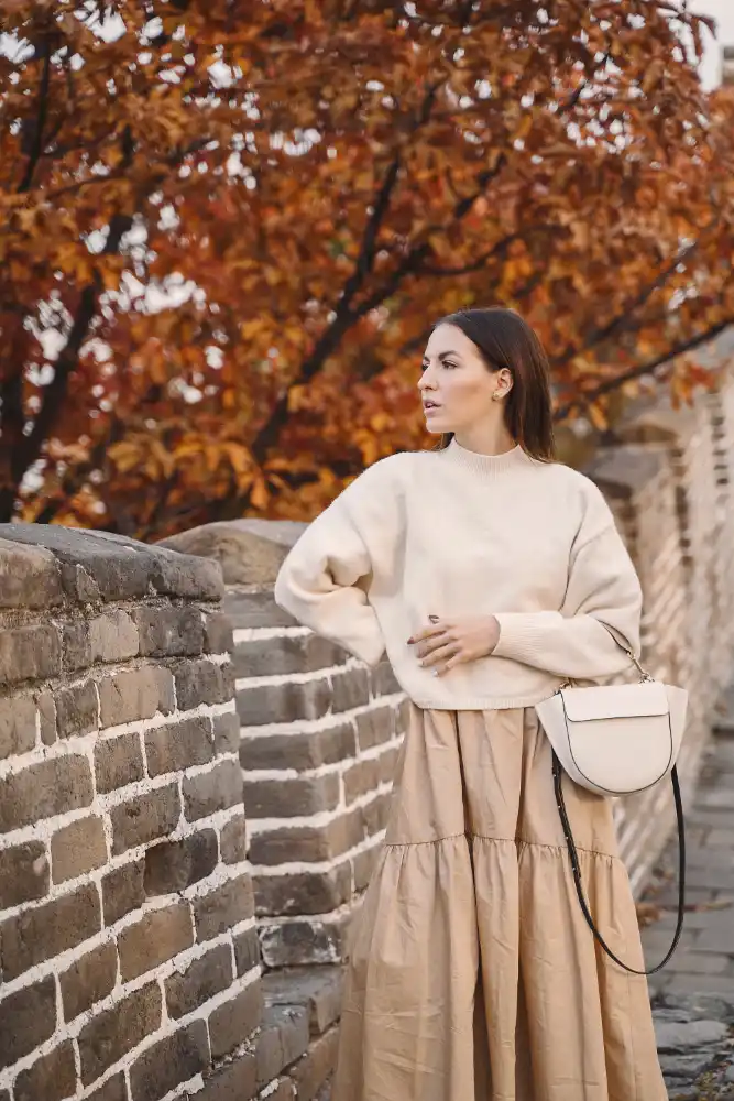 How to Wear a Maxi Dress Over 40 (5 Ways) 7 Turn it into a skirt with a fitted sweater on top