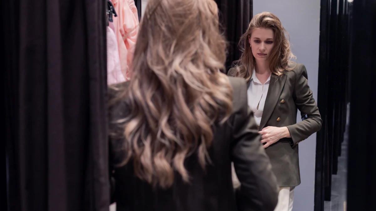 Why Nothing Looks Good on Me Anymore (Over 40 Guide) 5 Fitting room mirror and harsh lighting, a common shopping frustration after 40