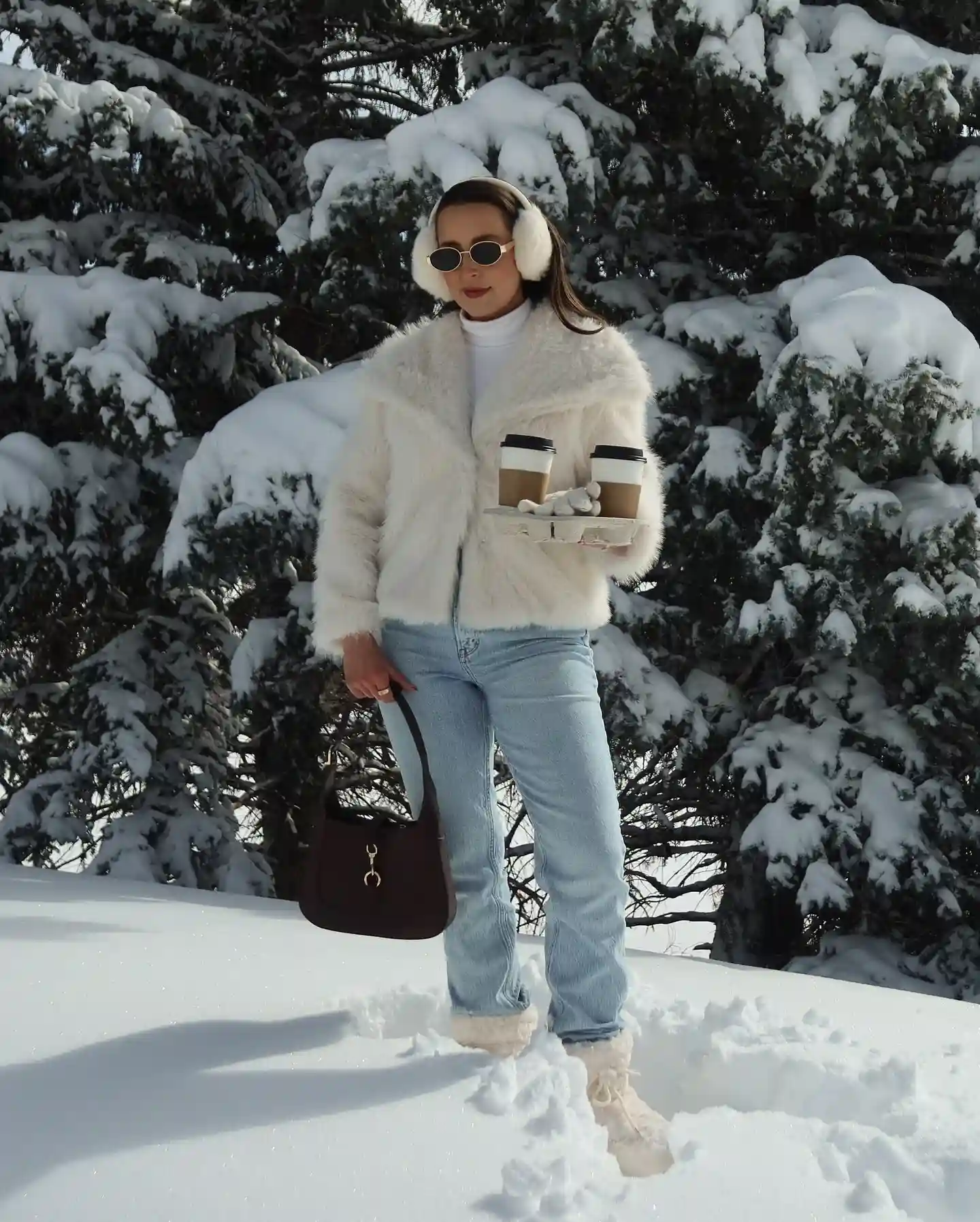 2. Cream Faux Fur Jacket With Light Wash Jeans and Earmuffs
