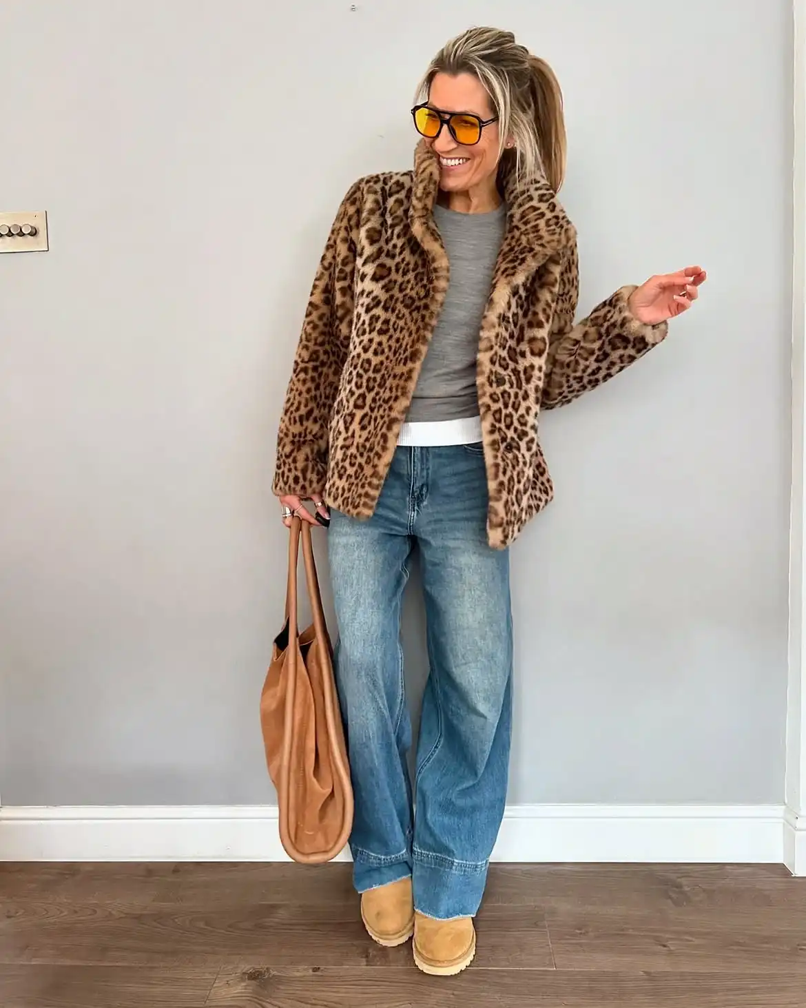 Modern Style: 20 Fall Outfits for Women Over 50 14 13. Leopard Faux Fur Jacket with Wide Jeans