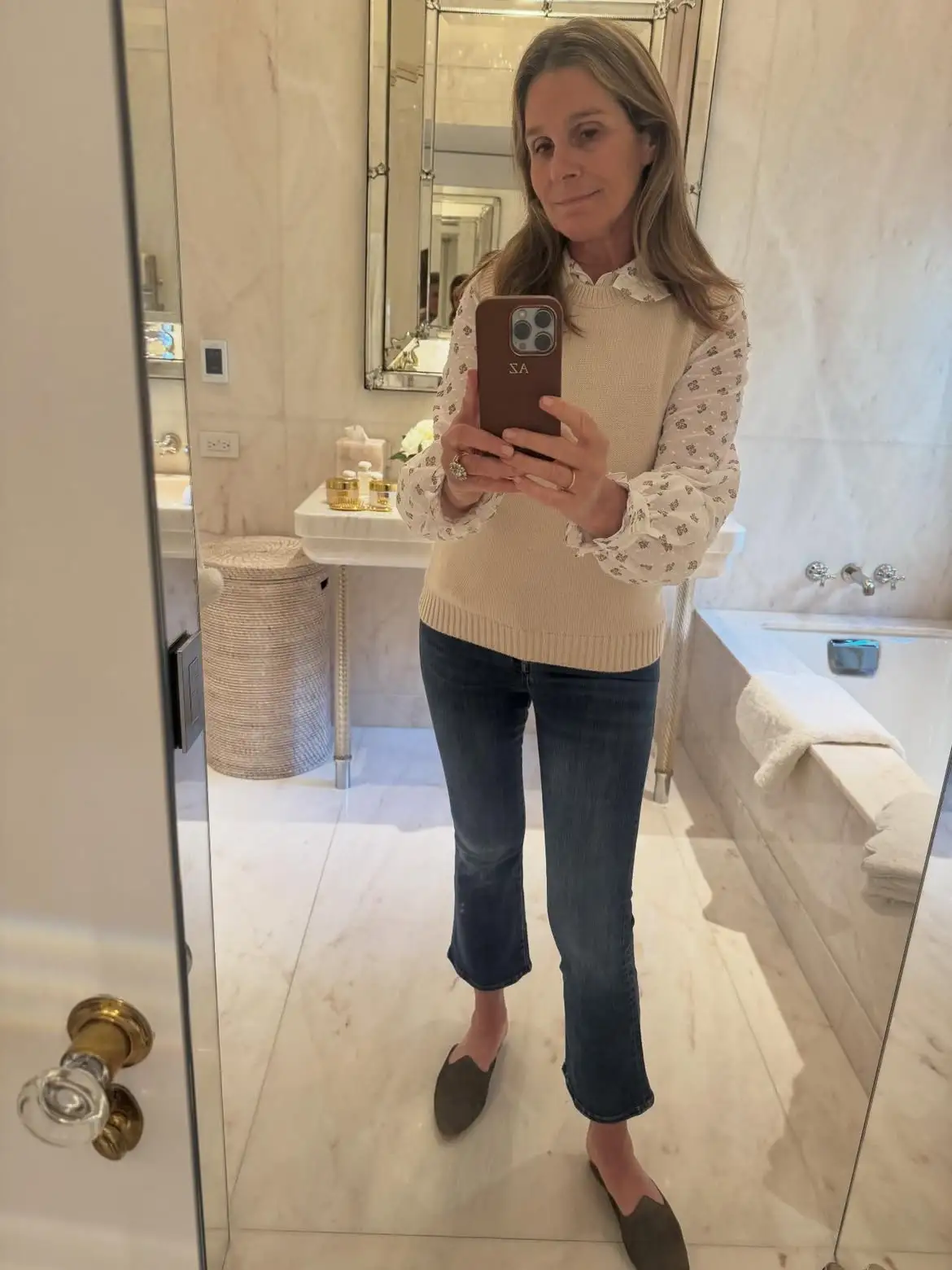 15 Cashmere Outfits for Women Over 40 That Feel Cozy and Polished 13 12. Cream Knit Vest Over a Printed Puff Sleeve Blouse