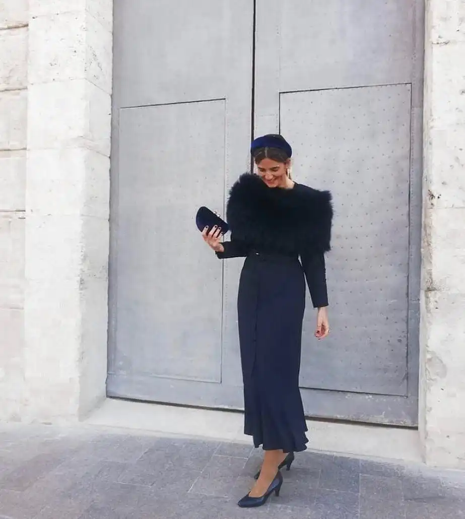 15 Winter Wedding Guest Outfits Over 40 That Handle the Cold 16 All Navy With a Feather Stole and Velvet Headband