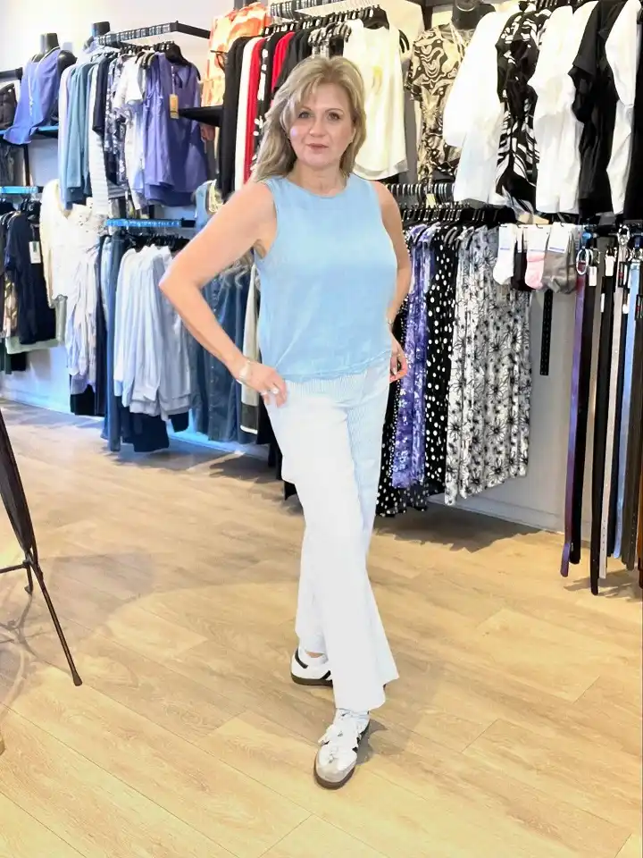 16 Spring Transitional Outfits Over 40 (Winter-to-Spring) 17 A Sleeveless Blue Shell With Pinstripe Cropped Trousers