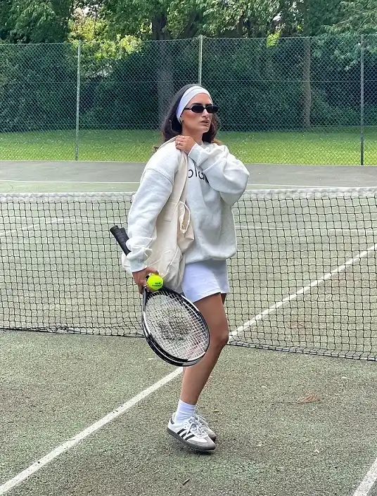 An Oversized Sweatshirt Over a White Skort for Cool, Cloudy Courts