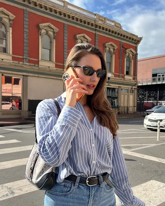 18 Spring Work Outfits for Women Over 40 That Feel Fresh, Not Fussy 7 Belted Striped Shirt With Light Wash Jeans