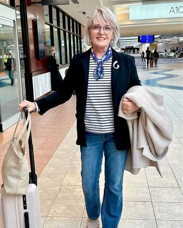 20 Classy Outfits for Women Over 40 12 Black Knit Blazer and Breton Tee for Travel Days