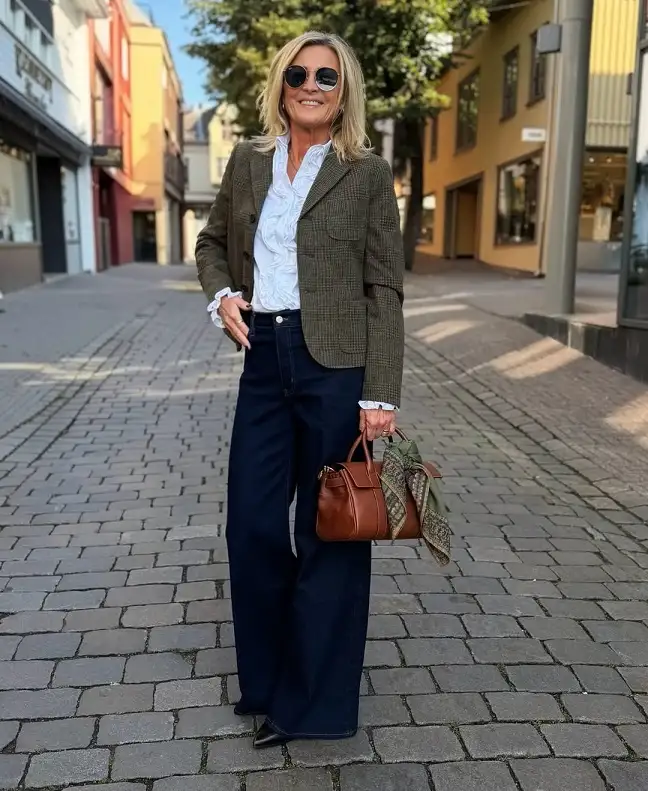 18 Preppy Outfits for Women Over 40 11 Olive Check Blazer With a Ruffled Blouse and Dark Wide Jeans