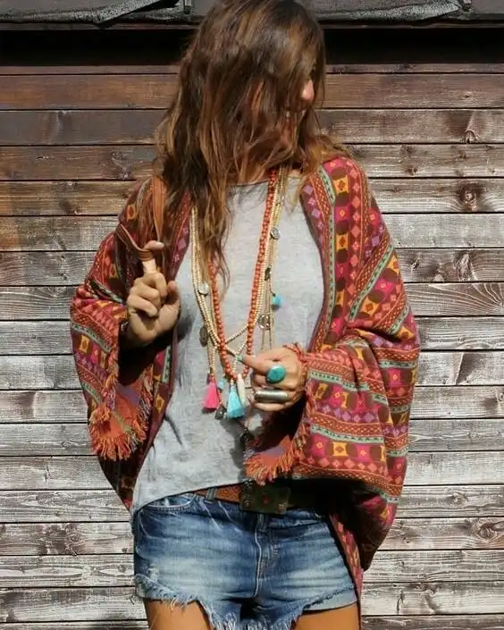 18 Boho Outfits for Women Over 40 (Not Costume-y) 19 Fringed Tribal Print Poncho with Denim
