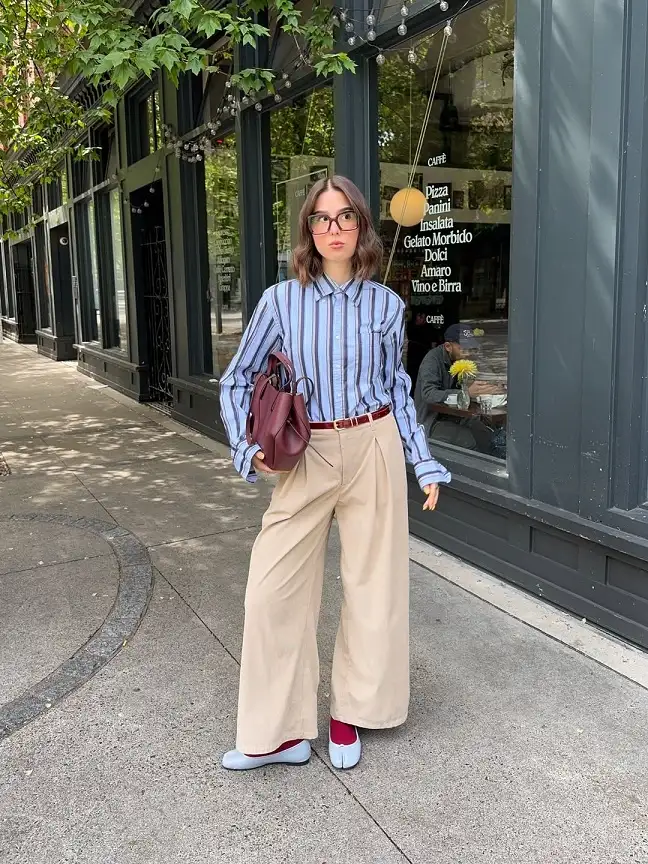 18 Spring Work Outfits for Women Over 40 That Feel Fresh, Not Fussy 2 Striped Shirt With Wide Pleated Trousers