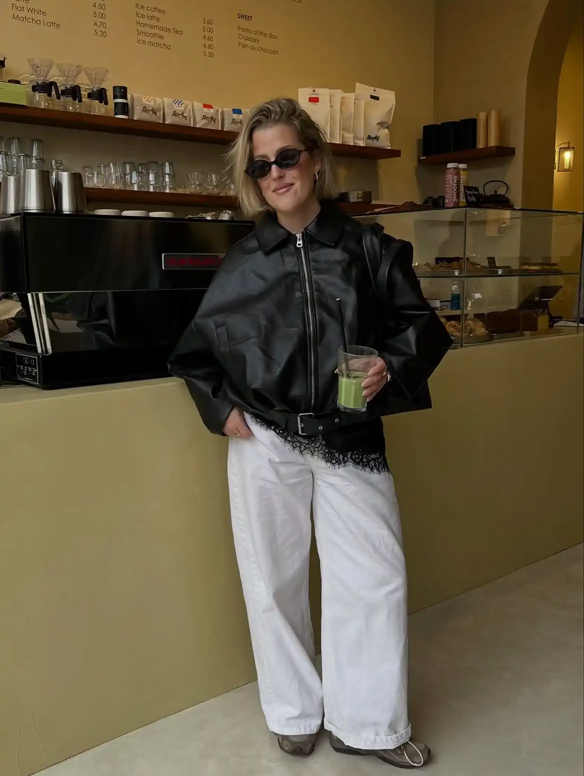 15 Leather Jacket Outfits for Women Over 40 That Actually Work 6 5. Oversized Black Jacket with White Wide Leg Jeans
