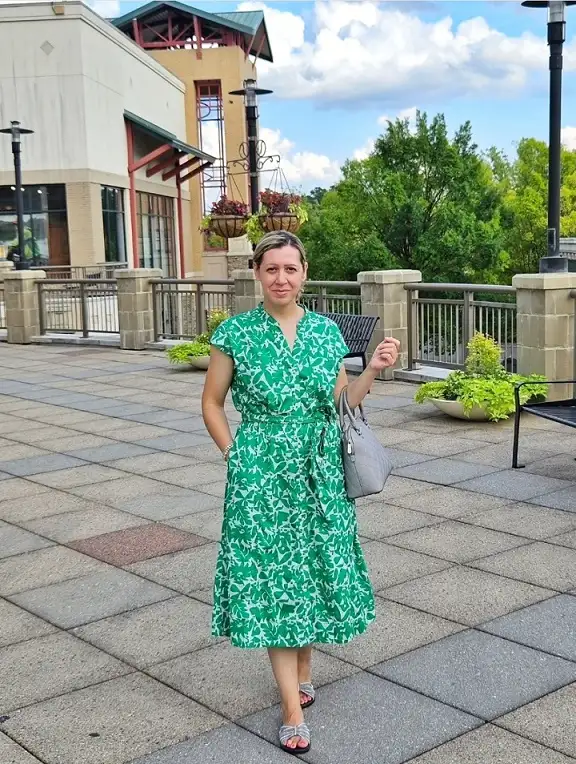 15 Chic Outfits for Women Over 40 You Can Copy This Week 11 Green Leaf Print Midi Dress With a Tie Waist