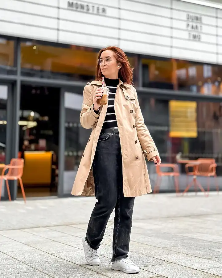 Classic Beige Trench With Black Jeans and a Striped Turtleneck
