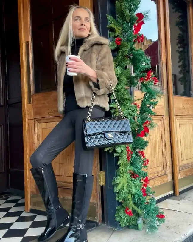20 Chic Winter Outfits for Women Over 40 That Aren't Frumpy 13 Faux Fur Jacket With Patent Boots
