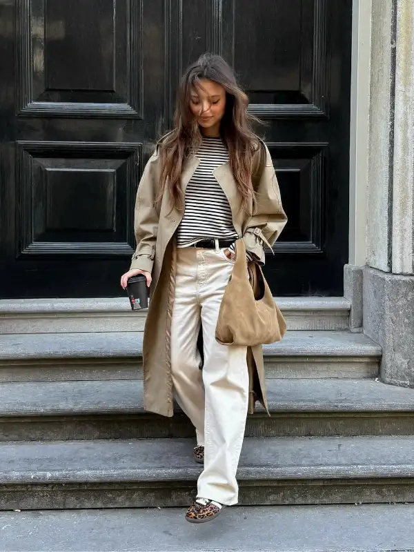 15 Fall Transitional Outfits for Women Over 40 (Summer-to-Fall) 13 12. Long Trench Over a Striped Tee and Ecru Wide Leg Jeans