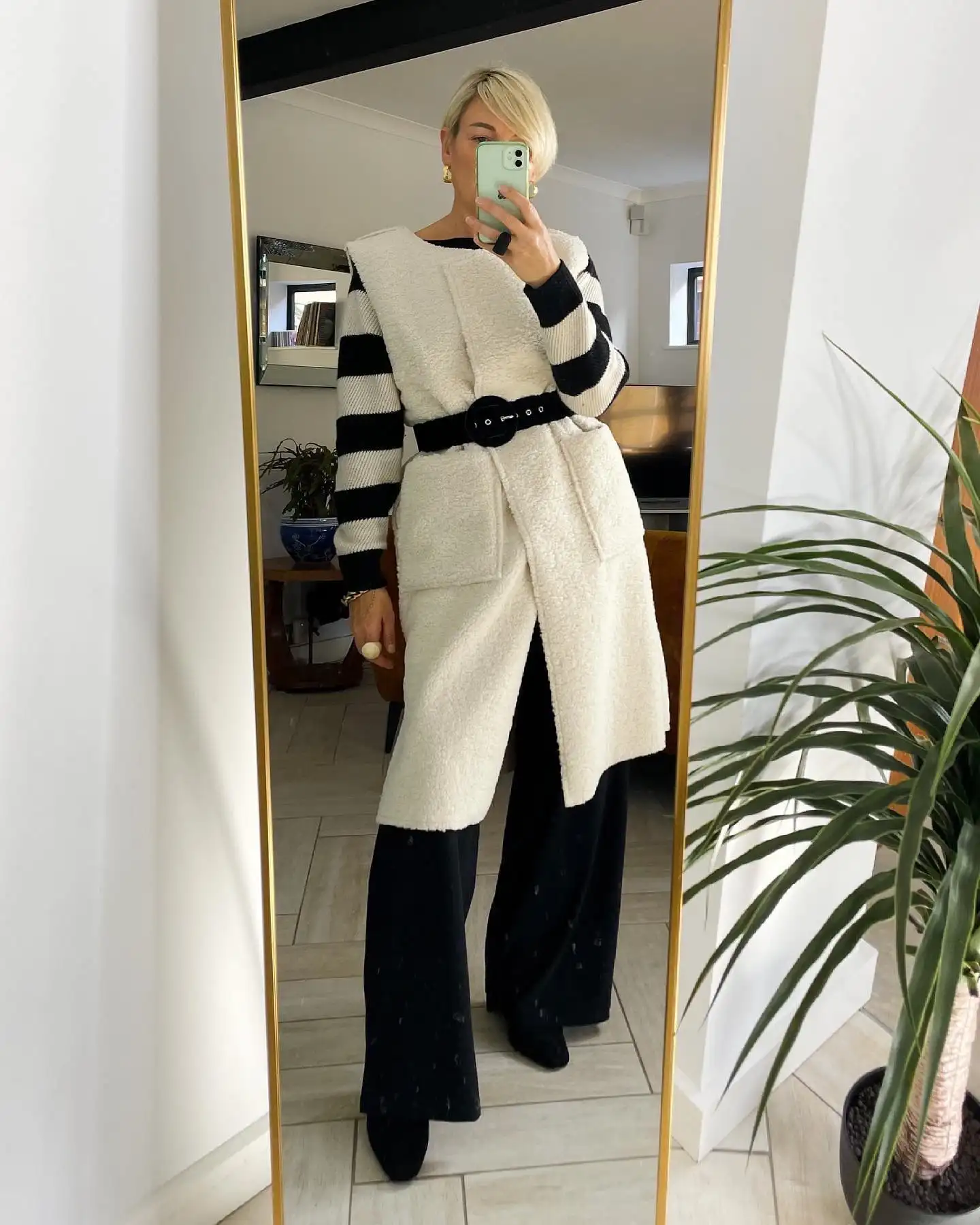 Fall Capsule Wardrobe for Women Over 40 (20 Pieces) 4 3. Cream Sherpa Sleeveless Coat