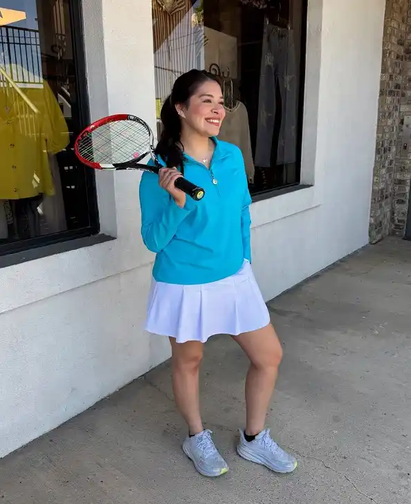 A Turquoise Quarter Zip With a Box Pleat Skirt for a Bright Mood