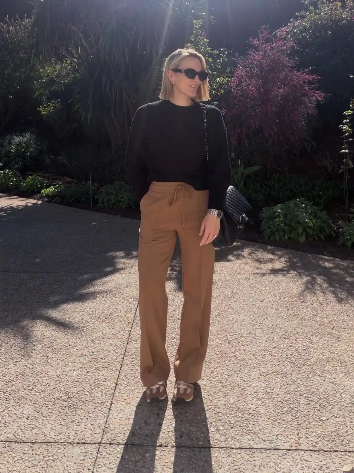 15 Cashmere Outfits for Women Over 40 That Feel Cozy and Polished 12 11. Black Crewneck and Camel Drawstring Pants
