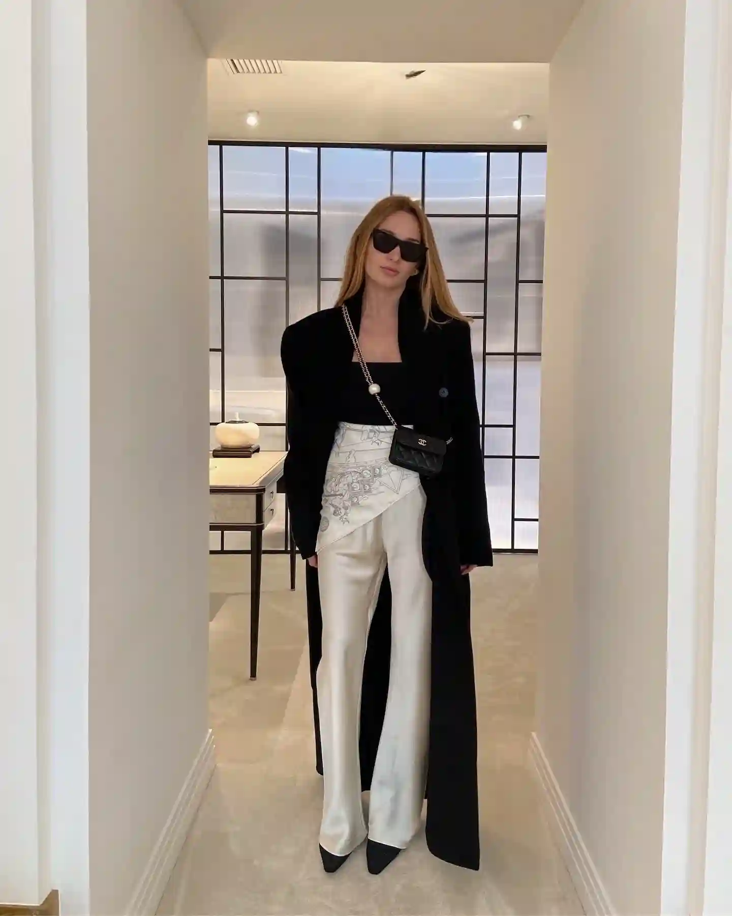 11. Ivory Satin Pants With a Scarf Belt and Long Black Coat
