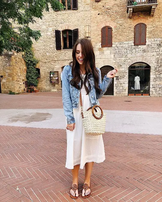 17 Italy Vacation Outfits for Women Over 40 That Look Effortlessly Chic 4 Cropped Denim Jacket with a White Midi Sundress