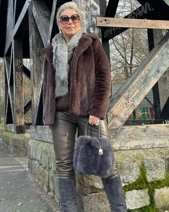 20 Chic Winter Outfits for Women Over 40 That Aren't Frumpy 16 Faux Fur Coat With Olive Leather Pants