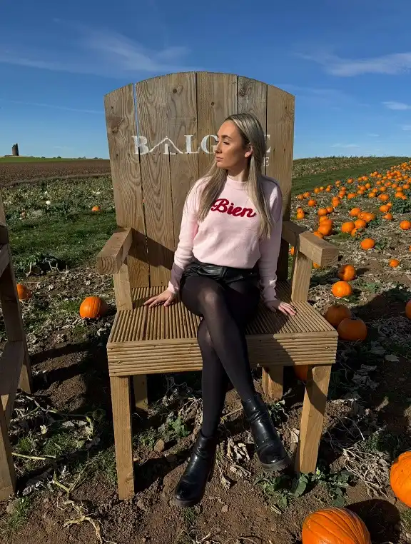 16 Pumpkin Patch Outfits Over 40 That Handle Mud, Hay, and Photos 4 Pink Slogan Sweater With Leather Shorts and Black Tights