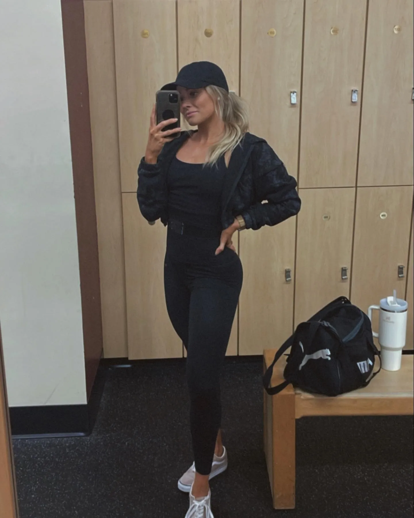12 Gym Outfits for Women Over 40 4 3. Cropped Bomber Jacket and All Black Basics