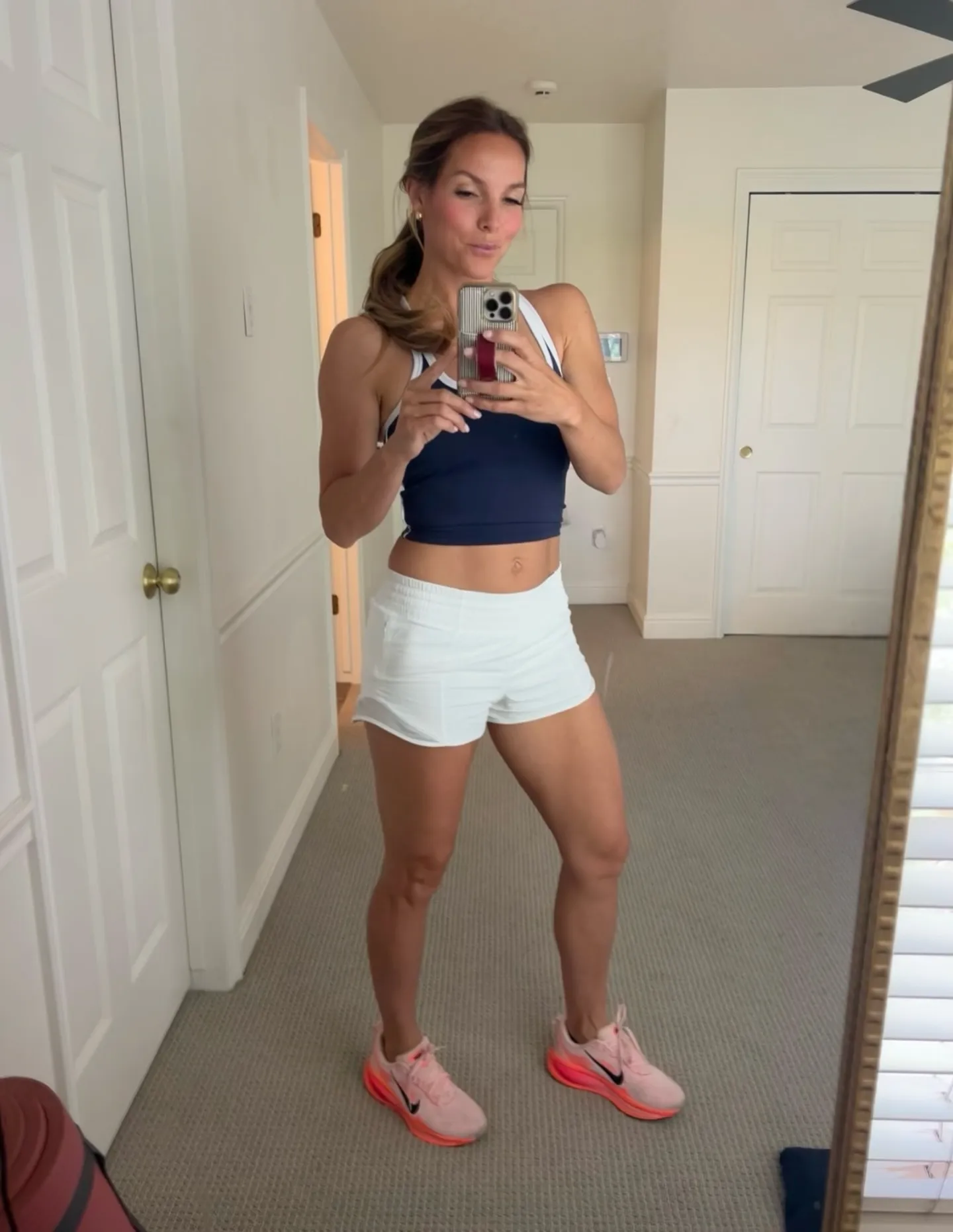 15 Athleisure Outfits for Women Over 40 13 12. Racerback Tank and Running Shorts