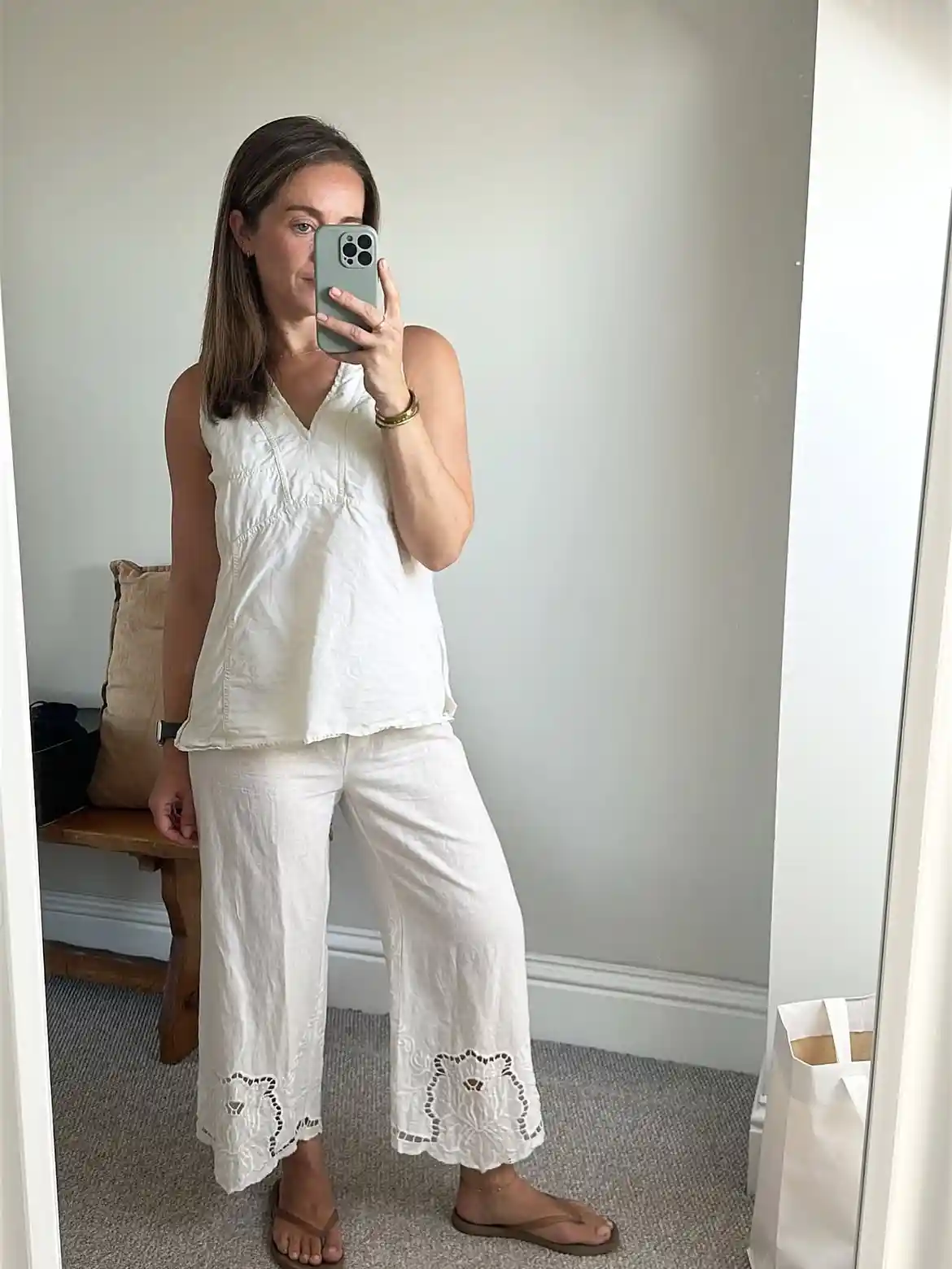 15 Linen Outfits for Women Over 40 That Feel Easy and Look Polished 13 12. White Linen Set With Cutout Hems