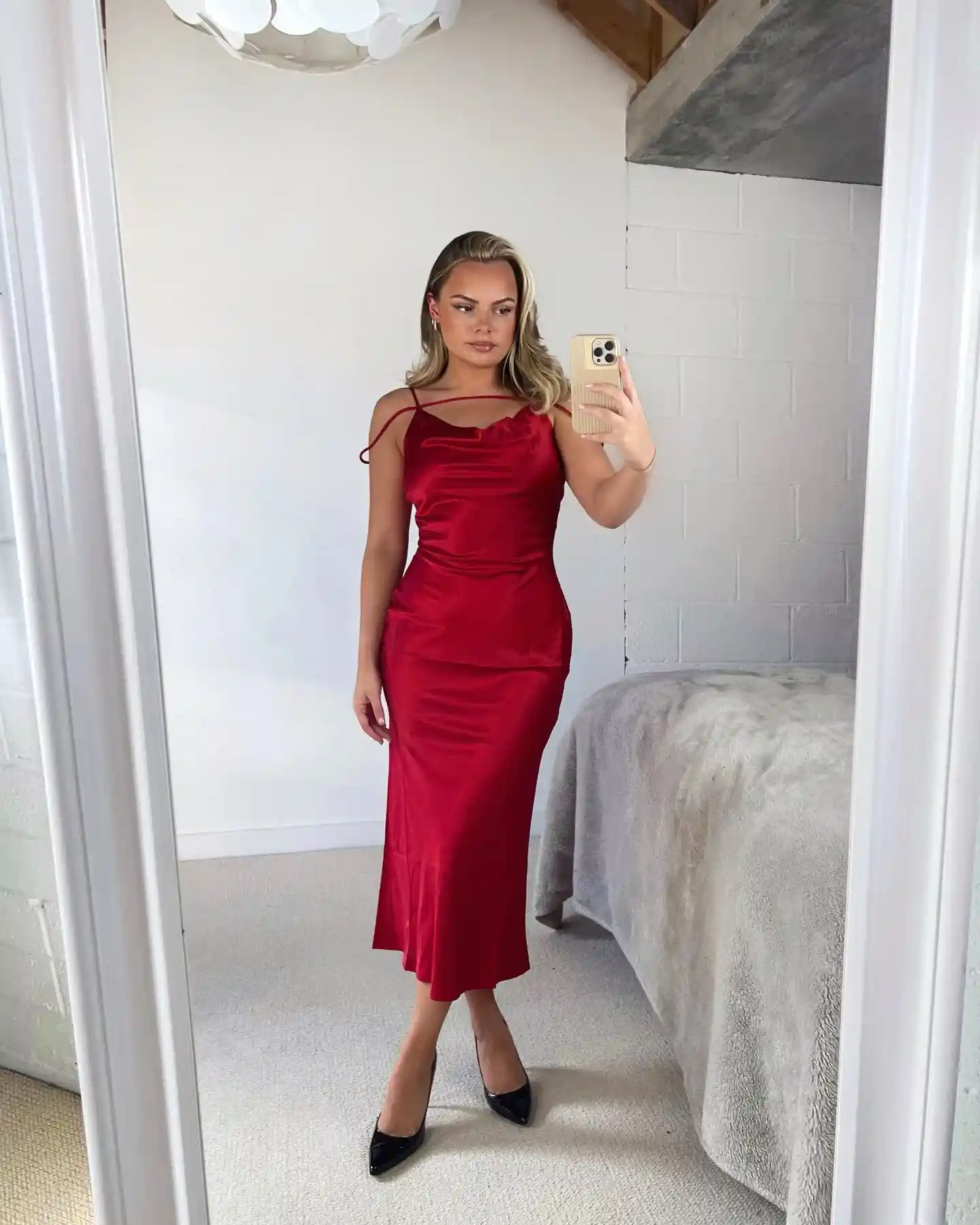 19 Holiday Outfits for Women Over 40 That Work for Parties, Dinners, and Sunny Trips 12 11. Red Satin Slip Dress for Party Season