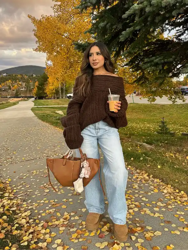 15 Fall Transitional Outfits for Women Over 40 (Summer-to-Fall) 5 4. Chocolate Off Shoulder Knit With Baggy Light Denim