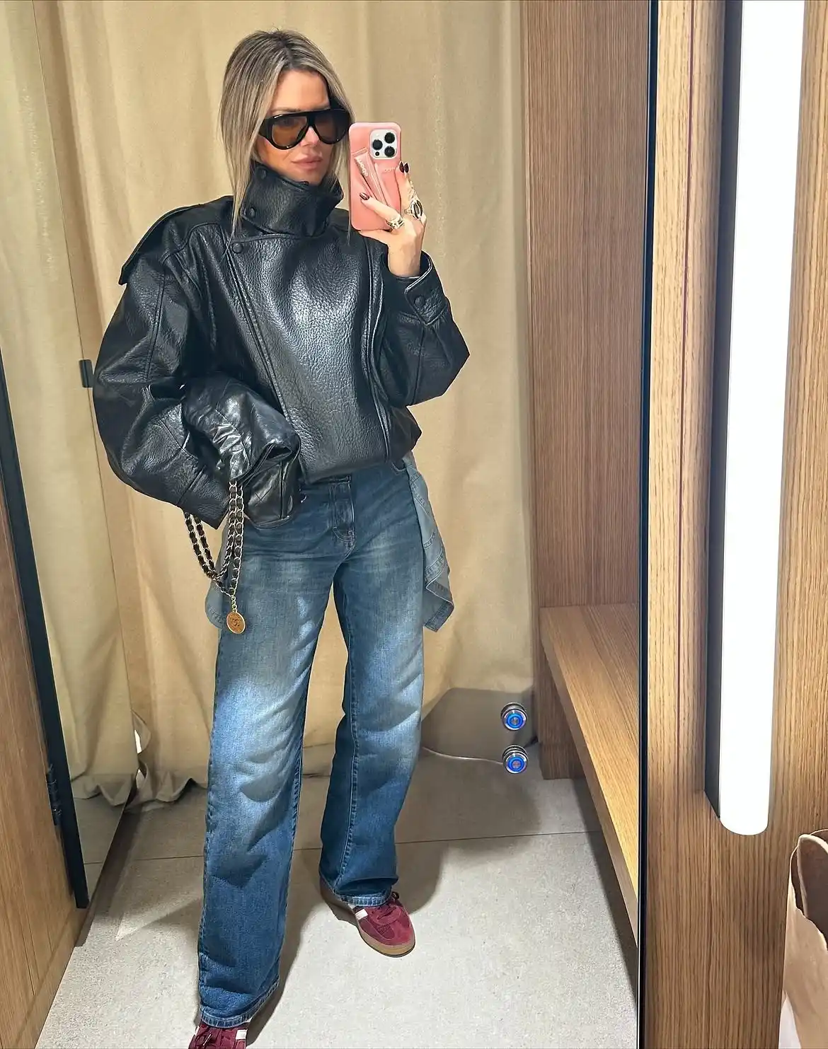 17 Leather Outfits Over 40 (Not Costumey) 4 3. Oversized Leather Jacket with Wide Leg Jeans