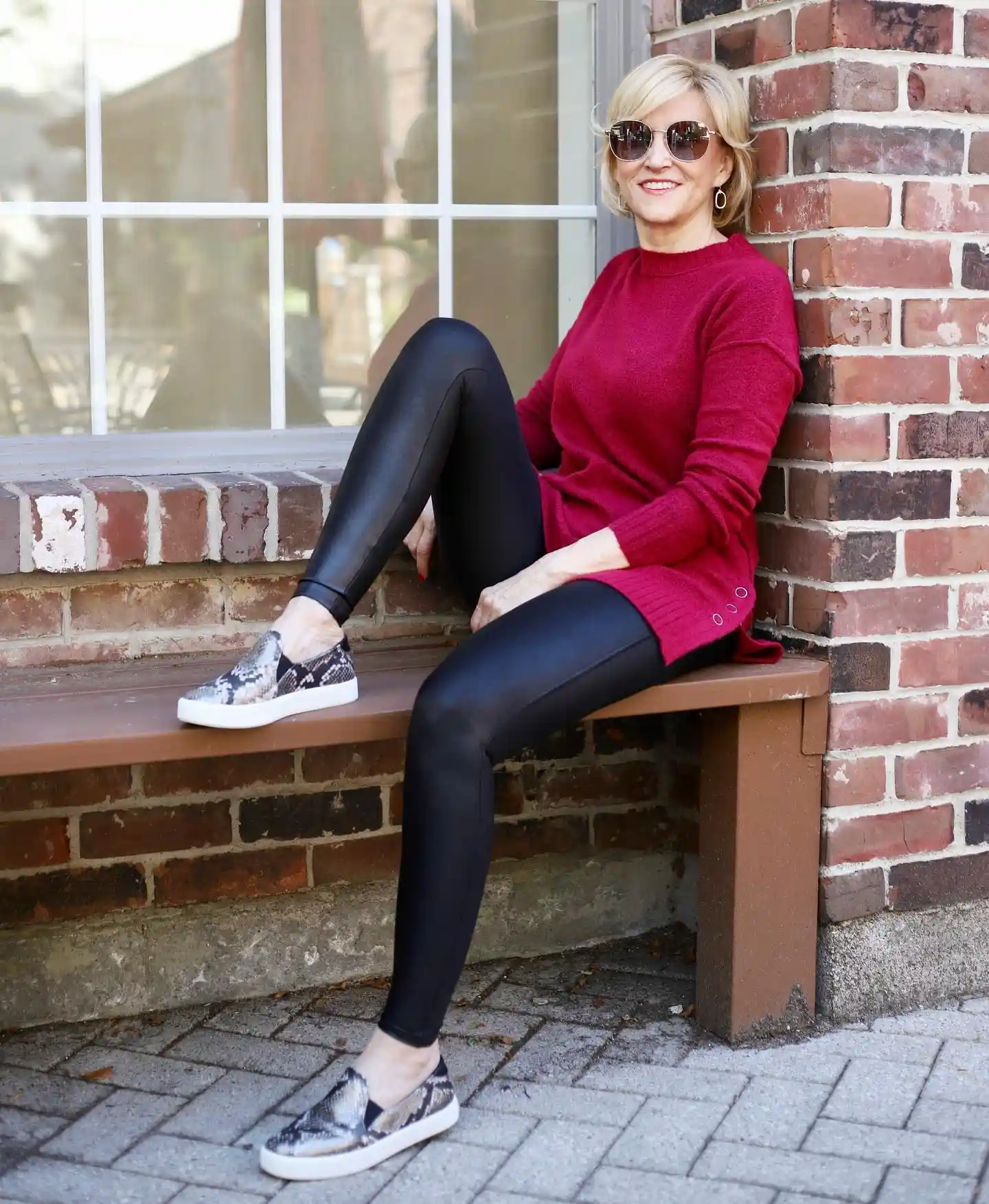 15 Leggings Outfits for Women Over 40 That Don't Look Sloppy 2 1. Faux Leather Leggings with a Berry Sweater