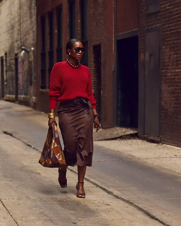 A Red Chunky Sweater With a Brown Suede Midi Skirt