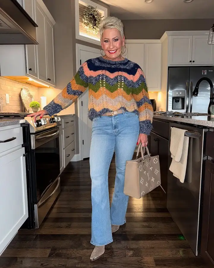 20 Work Outfits for Women Over 40 That Look Effortlessly Polished 19 Chevron Knit Sweater with Flared Light Jeans