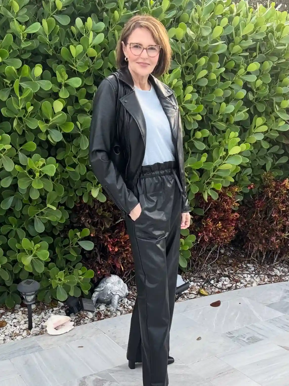 Modern Style: 20 Fall Outfits for Women Over 50 17 16. Faux Leather Jacket with Matching Trousers