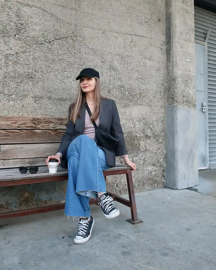 15 Chic Outfits for Women Over 40 You Can Copy This Week 14 Grey Blazer, Wide Leg Jeans, and a Baseball Cap