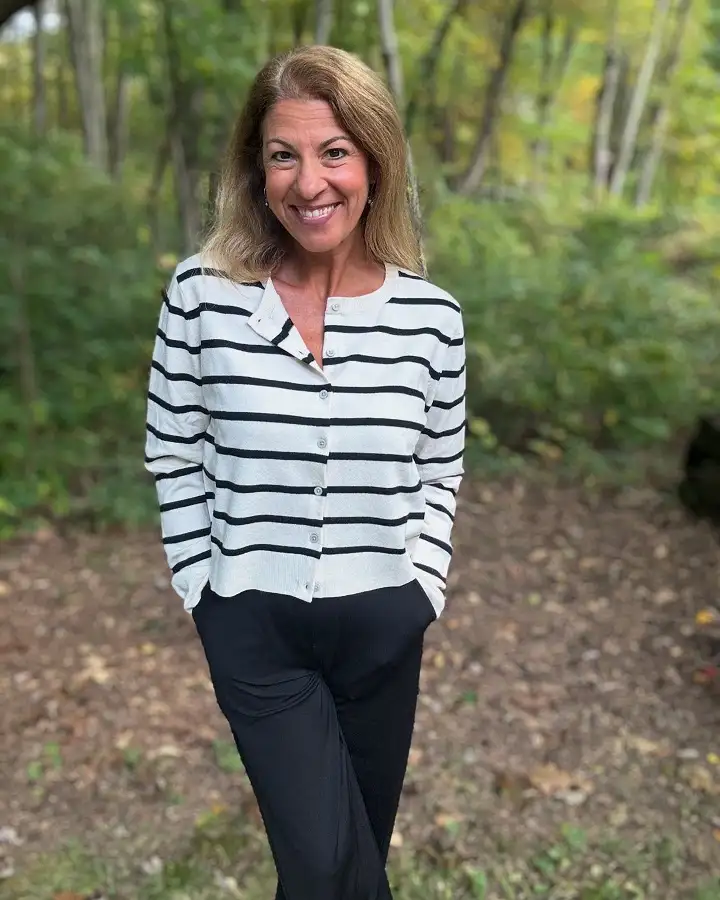 20 Work Outfits for Women Over 40 That Look Effortlessly Polished 12 Striped Button Cardigan with Black Trousers