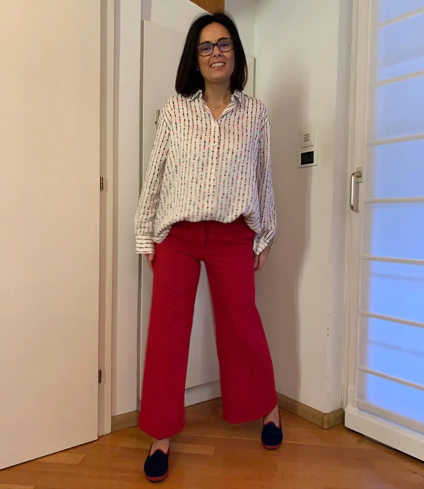 17. Printed Blouse with Red Flared Trousers