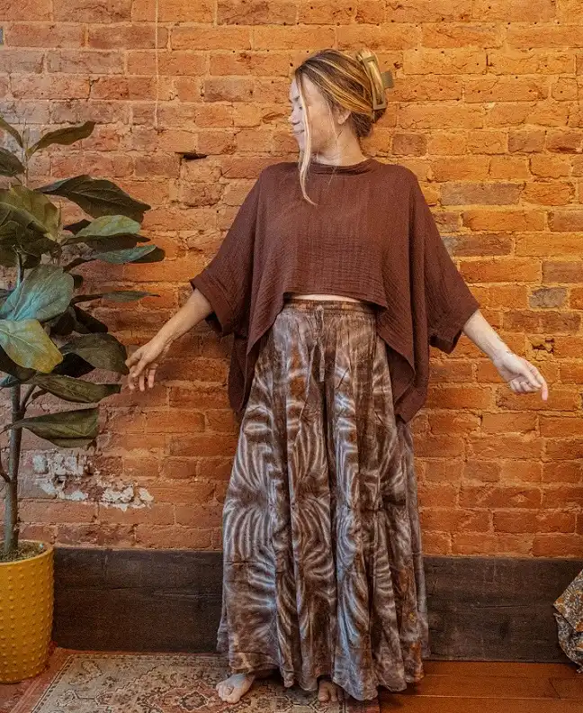 18 Boho Outfits for Women Over 40 (Not Costume-y) 7 Brown Gauze Poncho Top with a Tie Dye Maxi Skirt