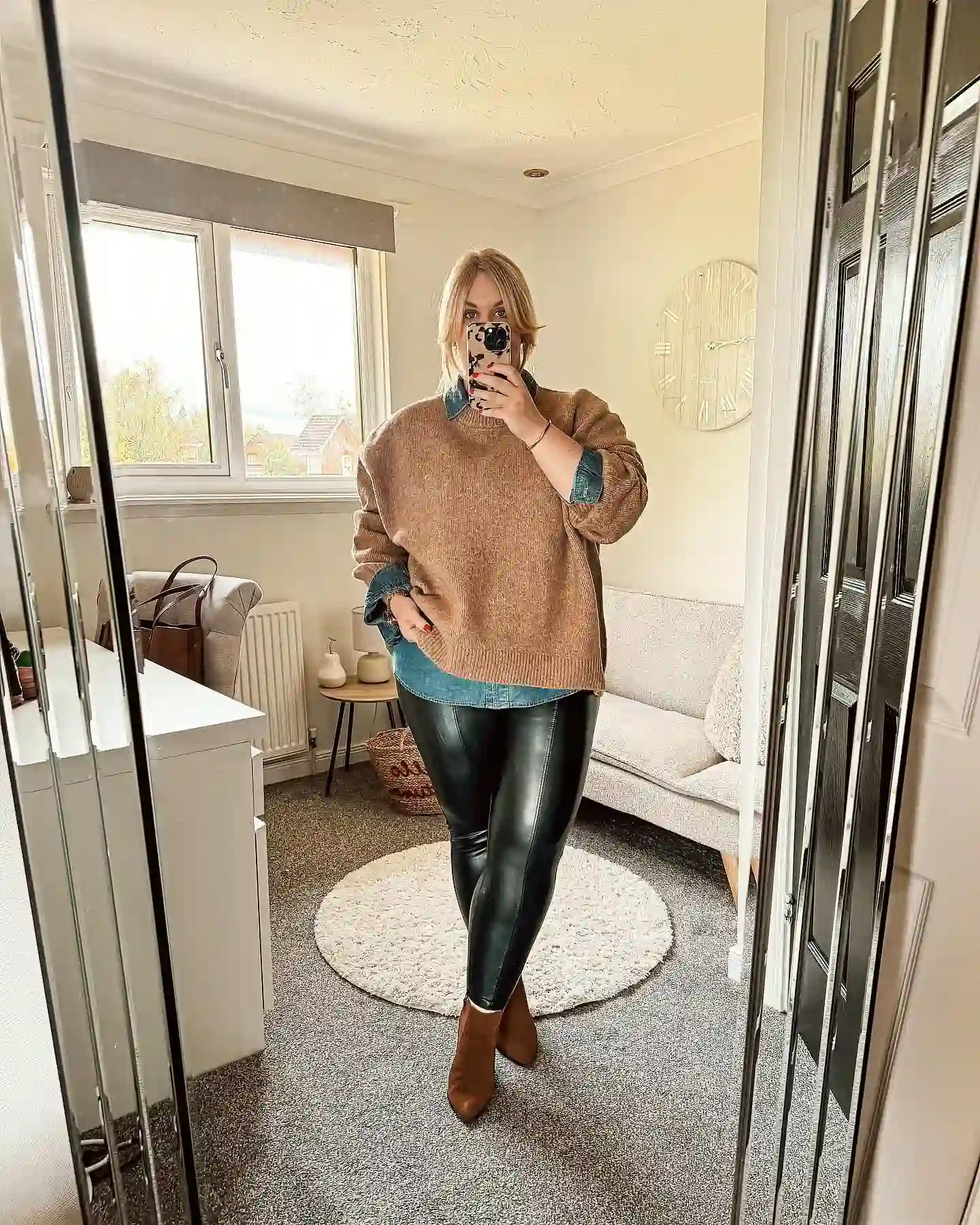 20 Ankle Boot Outfits for Women Over 40 20 19. Layered Sweater with Cognac Ankle Boots