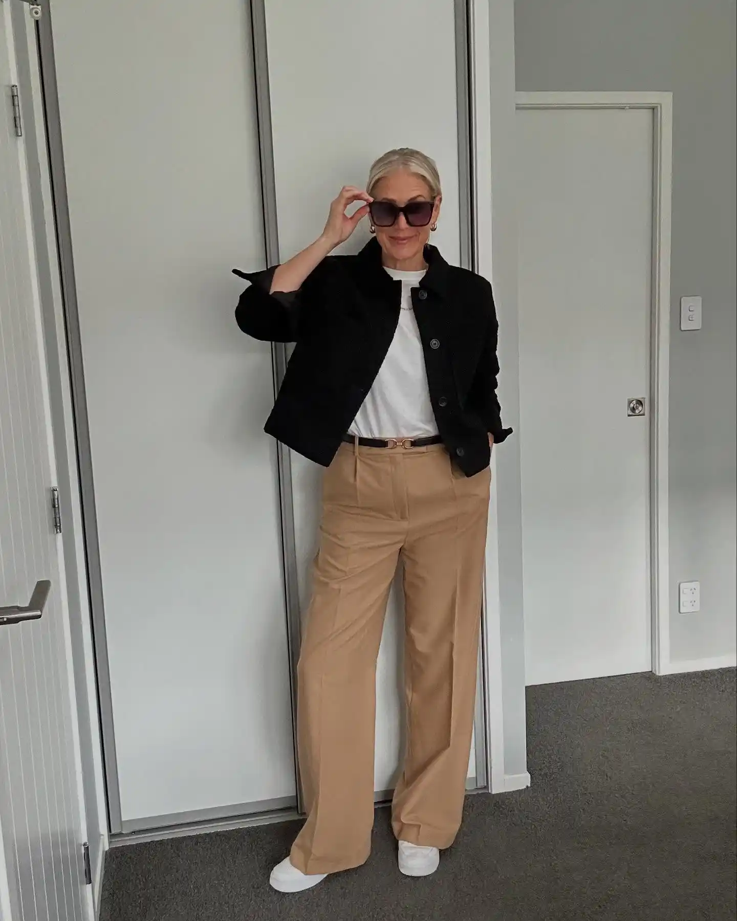 13 Working Mom Outfits Over 40 14 3. Black Wool Jacket and Camel Wide Leg Trousers