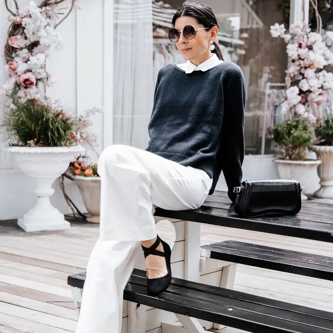 15 Cashmere Outfits for Women Over 40 That Feel Cozy and Polished 7 6. Navy Knit With a White Collar and Wide White Pants