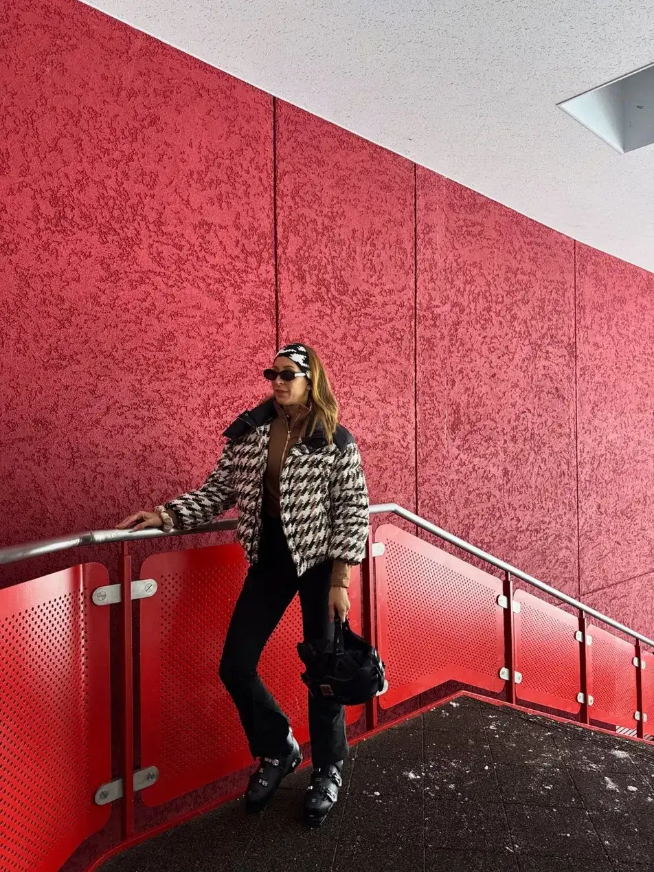 10. Houndstooth Puffer With a Brown Zip Neck Top and Black Flared Pants
