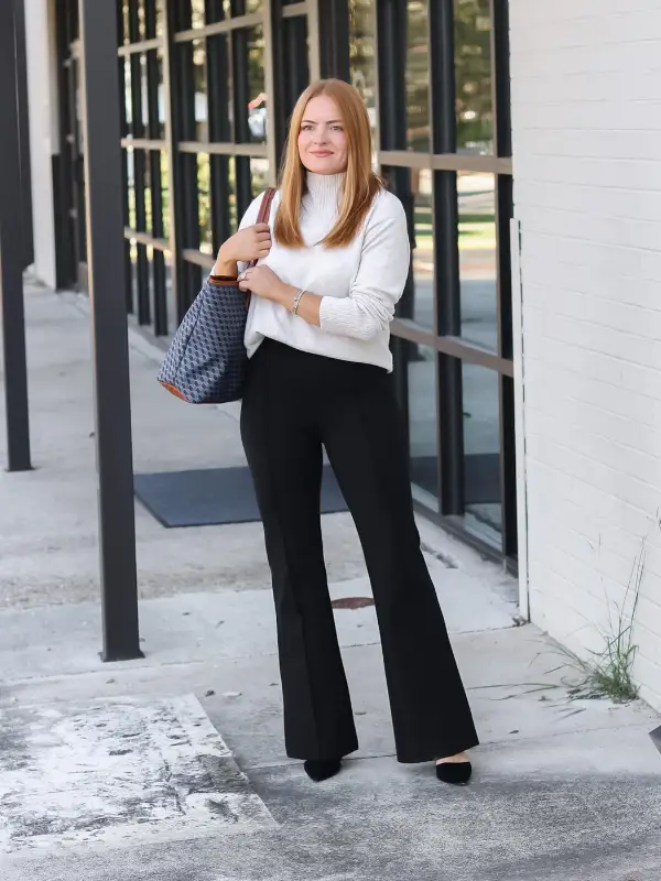 15 Business Casual Outfits for Women Over 40 11 10. White Turtleneck with Black Flare Trousers
