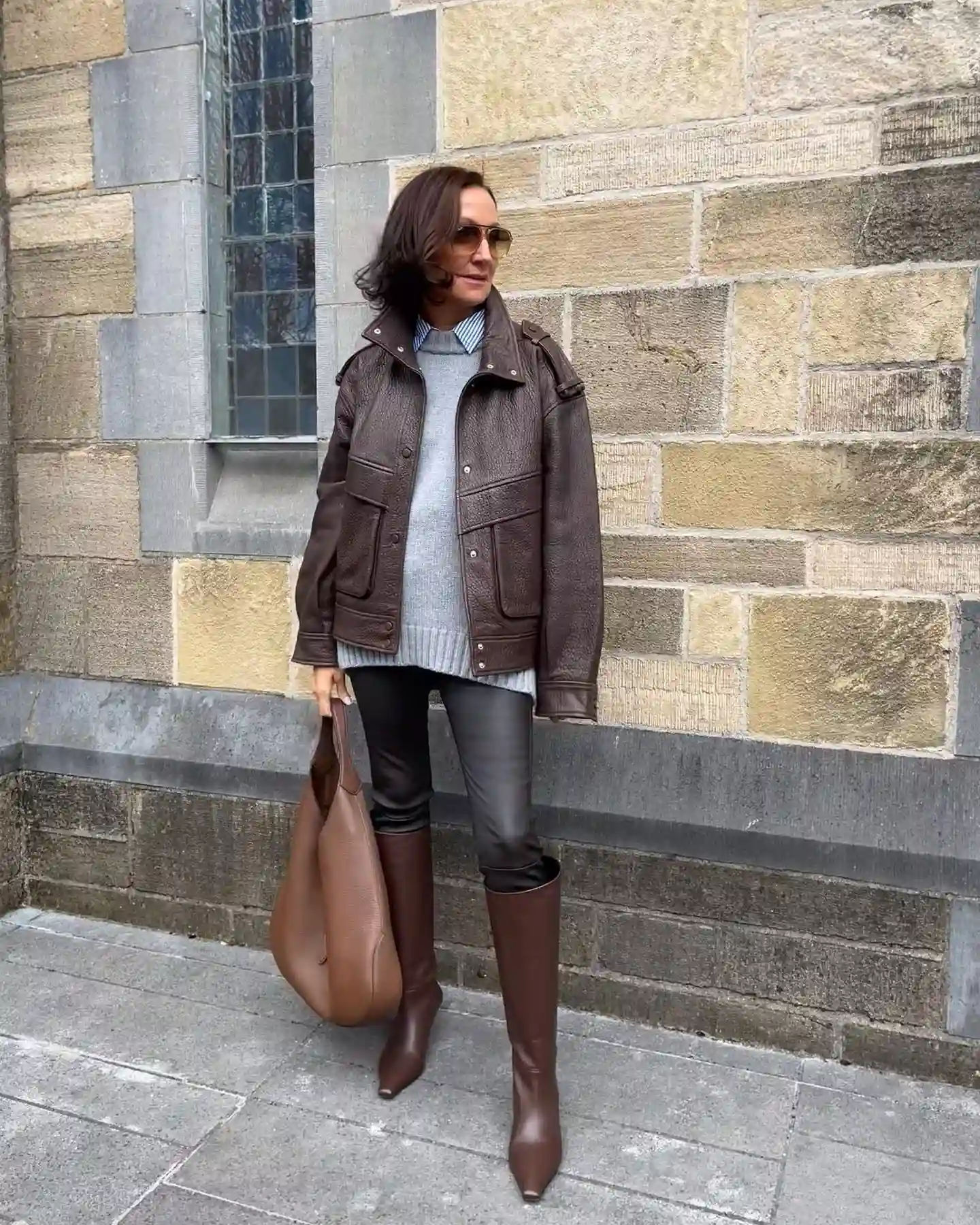 15 Leather Jacket Outfits for Women Over 40 That Actually Work 14 13. Utility Jacket with Leggings and Knee Boots
