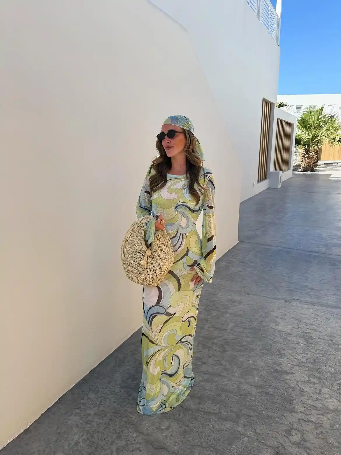 19 Holiday Outfits for Women Over 40 That Work for Parties, Dinners, and Sunny Trips 19 18. Swirl Print Maxi With a Matching Headscarf