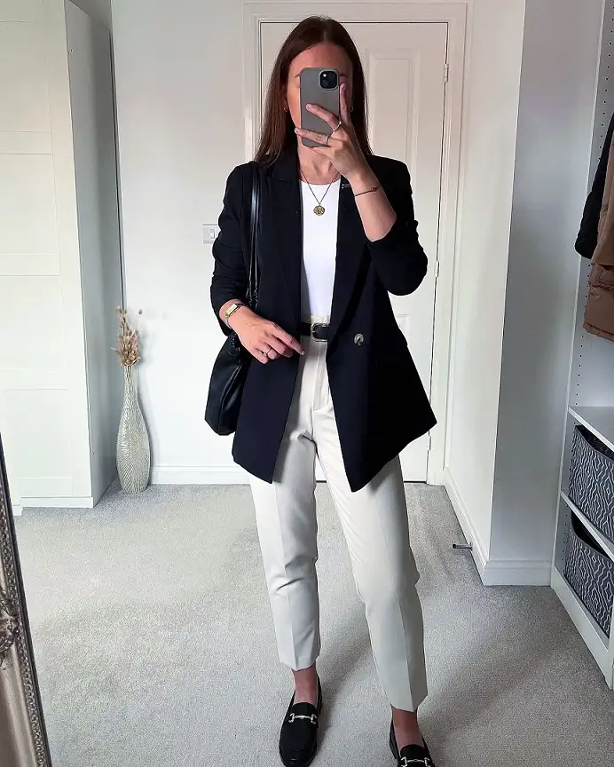 20 Work Outfits for Women Over 40 That Look Effortlessly Polished 8 Black Double Breasted Blazer with Stone Trousers