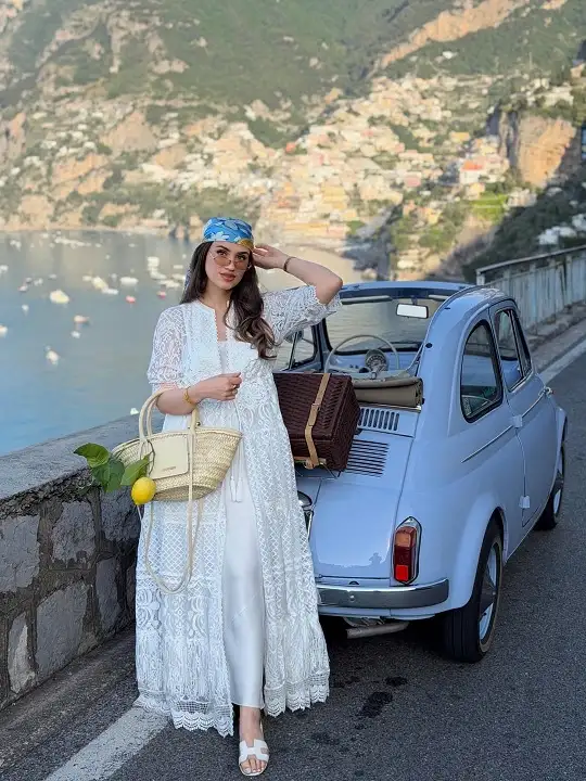 17 Italy Vacation Outfits for Women Over 40 That Look Effortlessly Chic 3 White Lace Duster over a Satin Slip Dress