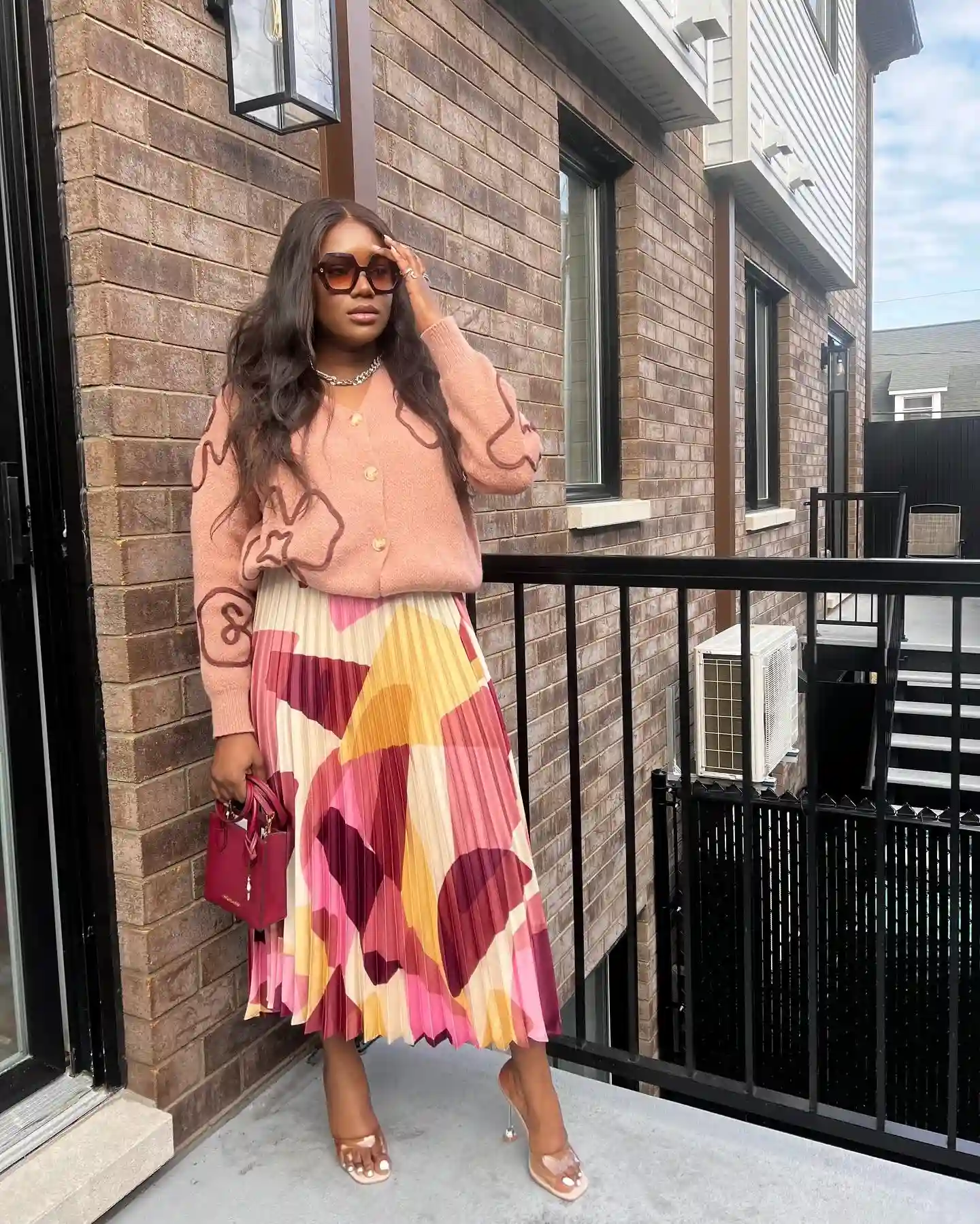 10. Geometric Pleated Skirt With a Dusty Pink Cardigan